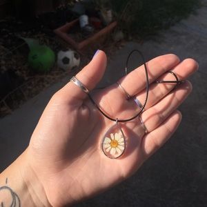 Teardrop shaped resin pendant with real flower